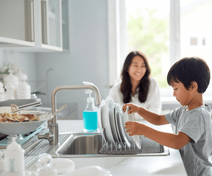 Child making their bed